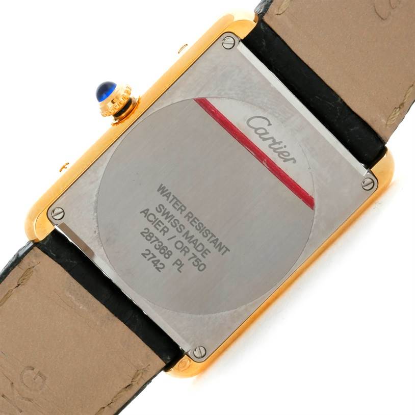 The image shows the back of a Cartier Tank Solo W1018855 Men
s Steel and Gold (two tone) Silver Dial W1018855 Men
s Steel and Gold (two tone) Silver Dial watch, displaying the case back, strap, and crown.