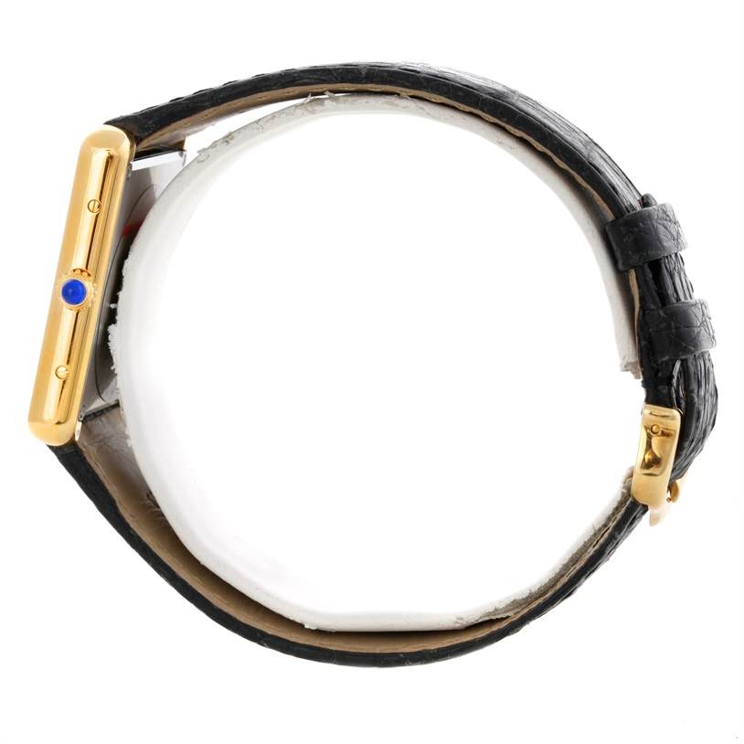 This image shows the Cartier Tank Solo W1018855 Men
s Steel and Gold (two tone) Silver Dial W1018855 Men
s Steel and Gold (two tone) Silver Dial watch from a side angle, focusing on the strap, crown, and buckle.