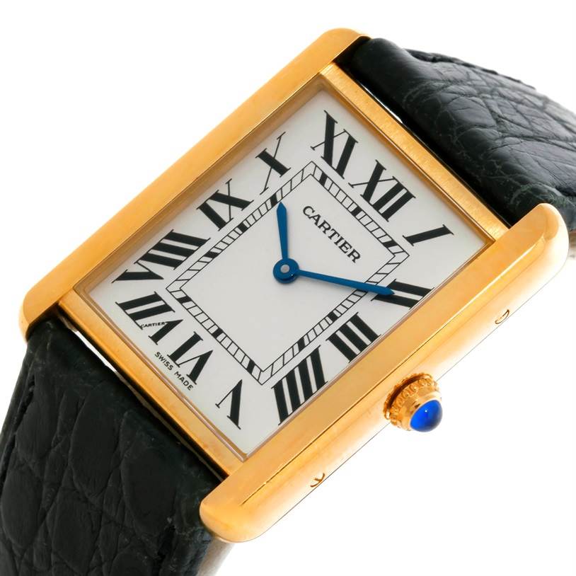 This image shows a Cartier Tank Solo W1018855 Men
s Steel and Gold (two tone) Silver Dial W1018855 Men
s Steel and Gold (two tone) Silver Dial watch at an angled view, highlighting the face, bezel, crown, and part of the strap.