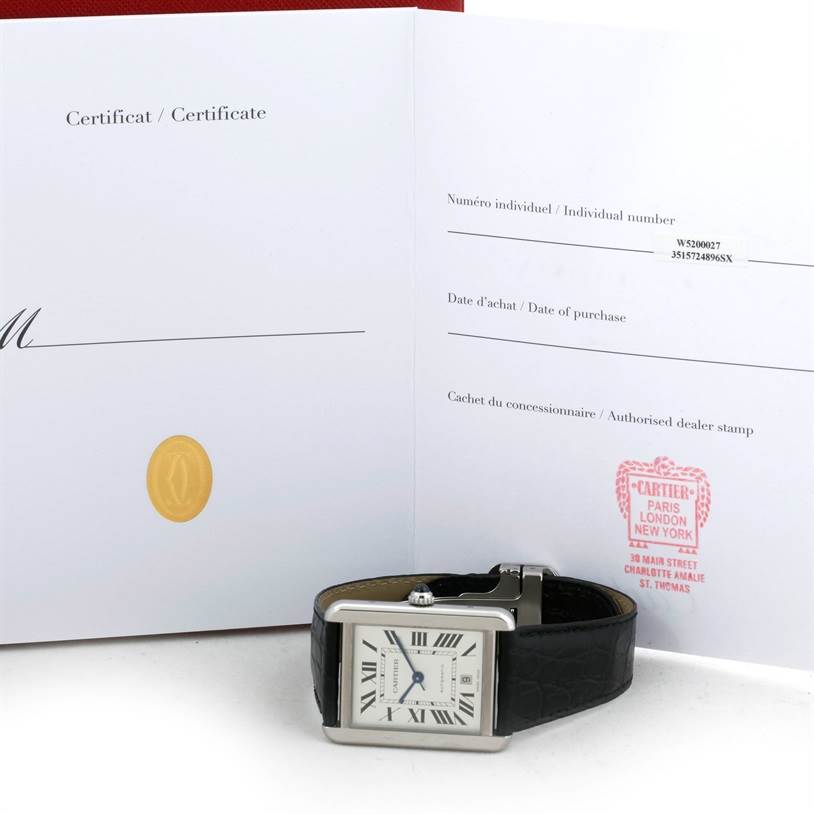 The image shows a Cartier Tank Solo W5200027 Men
s Stainless Steel Silver Dial W5200027 Men
s Stainless Steel Silver Dial watch and its certificate, with the watch facing forward and lying flat.