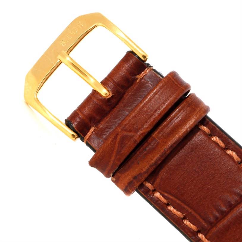 This image shows the brown leather strap and gold buckle of a Cartier Tank Solo W1018855 Men
s Steel and Gold (two tone) Silver Dial W1018855 Men
s Steel and Gold (two tone) Silver Dial watch.
