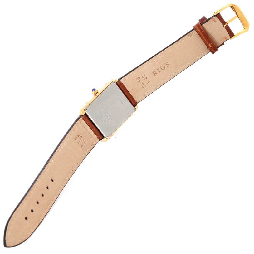 The image shows the back view of a Cartier Tank Solo W1018855 Men
s Steel and Gold (two tone) Silver Dial W1018855 Men
s Steel and Gold (two tone) Silver Dial watch, highlighting its case, leather strap, and buckle.