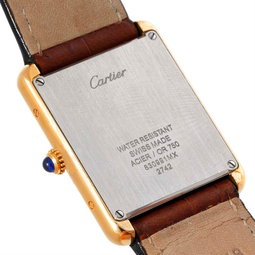 This image shows the back view of a Cartier Tank Solo W1018855 Men
s Steel and Gold (two tone) Silver Dial W1018855 Men
s Steel and Gold (two tone) Silver Dial watch, displaying its case back and part of the leather strap.