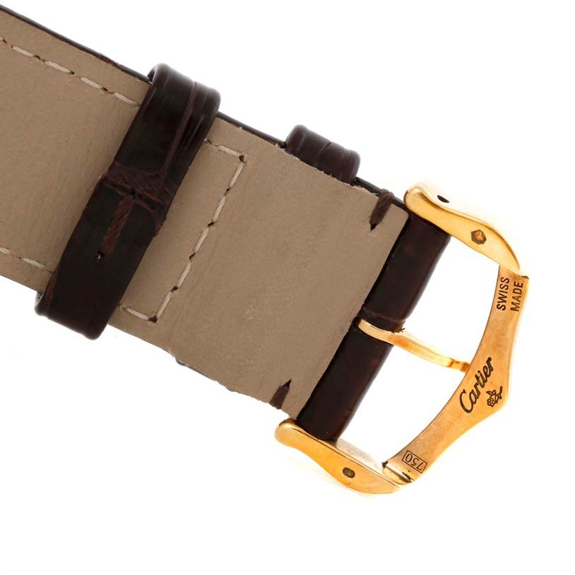 The image shows a close-up of the buckle and part of the leather strap of a Cartier Tank Solo W1018855 Men
s Steel and Gold (two tone) Silver Dial W1018855 Men
s Steel and Gold (two tone) Silver Dial watch.