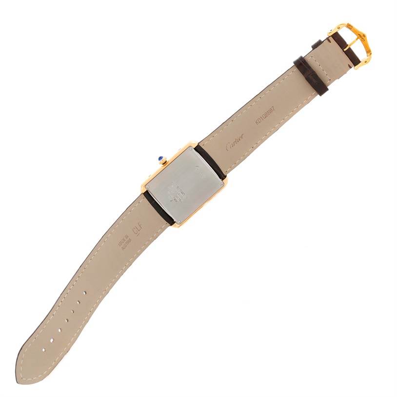 The image shows the back view of the Cartier Tank Solo W1018855 Men
s Steel and Gold (two tone) Silver Dial W1018855 Men
s Steel and Gold (two tone) Silver Dial watch, revealing its strap, buckle, and case back.