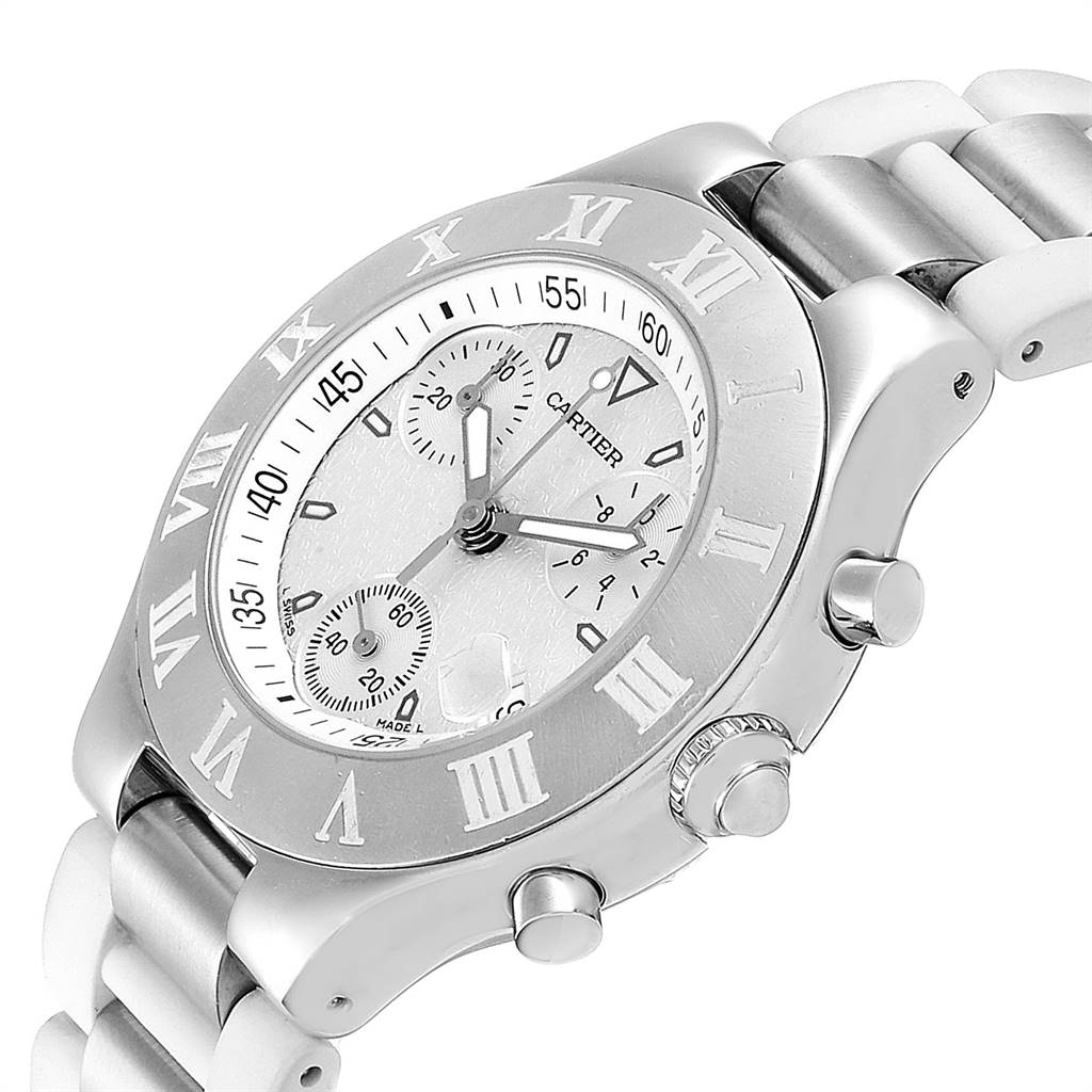 The Must 21 Chronoscaph watch by Cartier is shown at an angled close-up, highlighting its dial, bezel, and chronograph buttons.