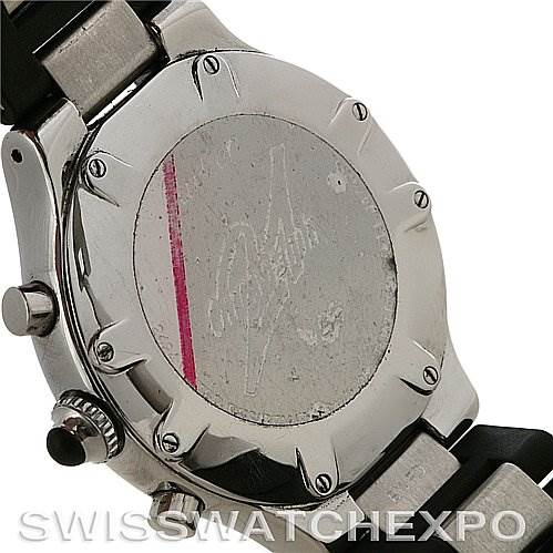 The image shows the back case, lugs, and pushers of the Must 21 Chronoscaph model by Cartier from an angled rear view.