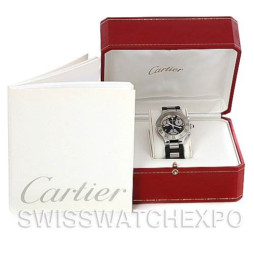 The image shows a Cartier Must 21 Chronoscaph W10125U2 Men's Stainless Steel Black Dial W10125U2 Men's Stainless Steel Black Dial watch positioned at a slight angle, inside an open red box, alongside a white Cartier booklet.
