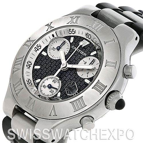 The image shows a Cartier Must 21 Chronoscaph W10125U2 Men
s Stainless Steel Black Dial W10125U2 Men
s Stainless Steel Black Dial watch from an angled view, highlighting its dial, chronograph sub-dials, bezel, and bracelet.