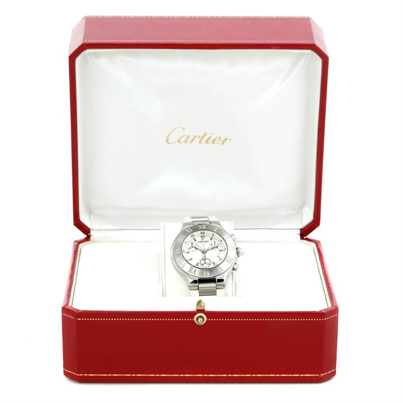 This image shows a Cartier Must 21 Chronoscaph W10184U2 Stainless Steel White Dial W10184U2 Stainless Steel White Dial watch displayed upright in an open red Cartier box.