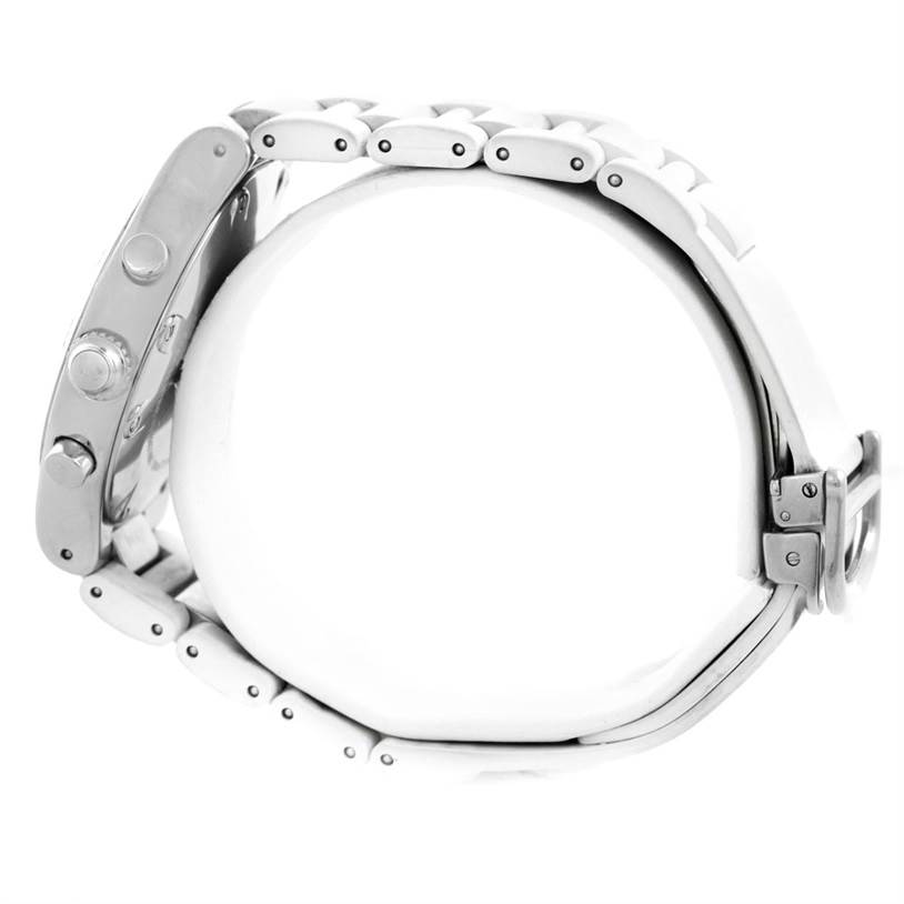 This image shows a side angle view of a Cartier Must 21 Chronoscaph W10184U2 Stainless Steel White Dial W10184U2 Stainless Steel White Dial watch, highlighting the case, buttons, and metal bracelet links.