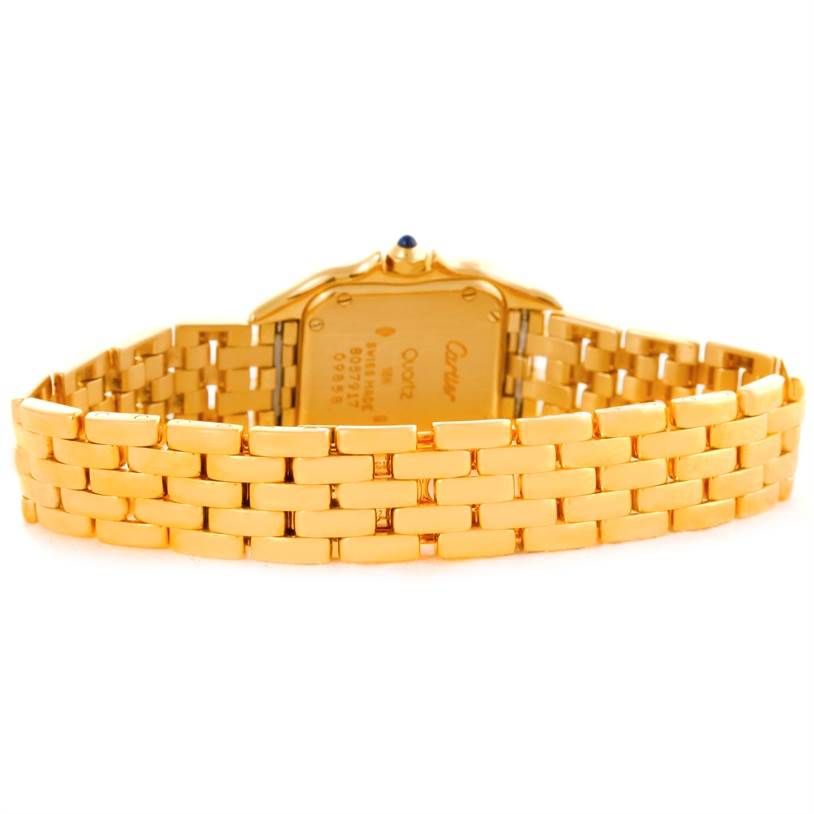 The image shows the back view of the Cartier Panthère model watch, highlighting its gold bracelet and case back.