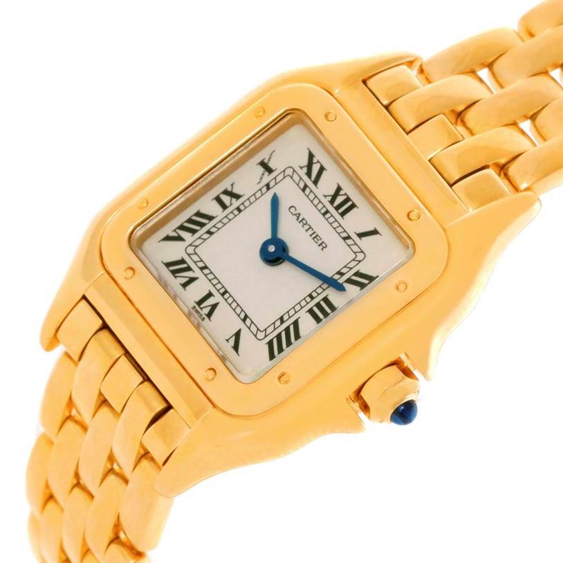 This image shows a close-up of the Cartier Panthere W25022B9 Women's Yellow Gold Silver Dial W25022B9 Women's Yellow Gold Silver Dial watch's gold bezel, bracelet, and Roman numeral dial at an angled view.