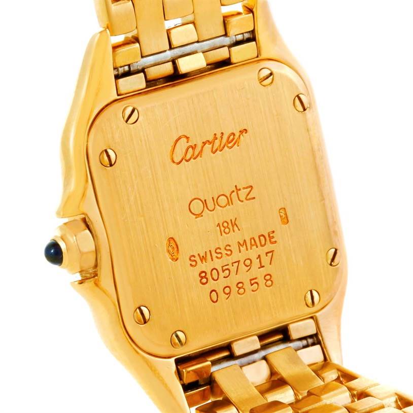 The image shows the back case and part of the bracelet of a Cartier Panthere W25022B9 Women's Yellow Gold Silver Dial W25022B9 Women's Yellow Gold Silver Dial quartz watch, highlighting marking details.