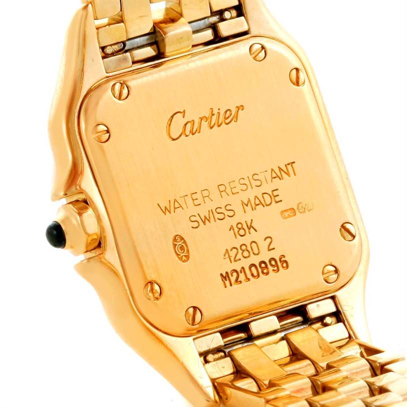 This image shows the back case and part of the gold band of a Cartier Panthere W25022B9 Women's Yellow Gold Silver Dial W25022B9 Women's Yellow Gold Silver Dial watch.