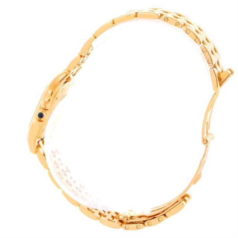 This image shows a side view of the Cartier Panthere W25022B9 Women's Yellow Gold Silver Dial W25022B9 Women's Yellow Gold Silver Dial watch, highlighting its gold bracelet, case, and crown with a blue gem.