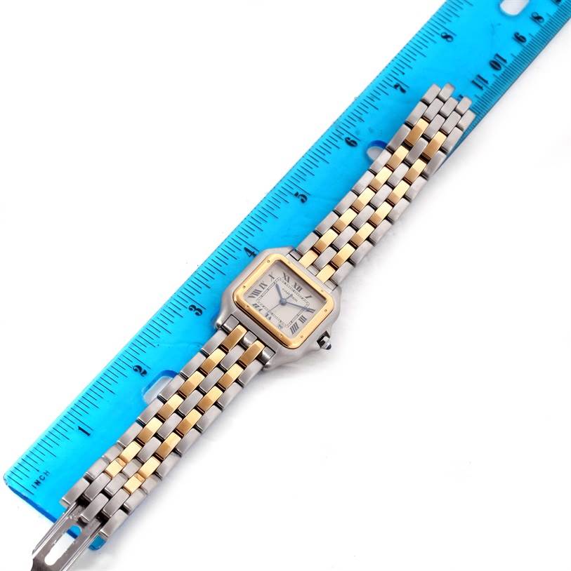 The Cartier Panthere W25028B8 Men
s Steel and Gold (two tone) Silver Dial W25028B8 Men
s Steel and Gold (two tone) Silver Dial watch is shown at a top-down angle with its face and full bracelet visible against a ruler.