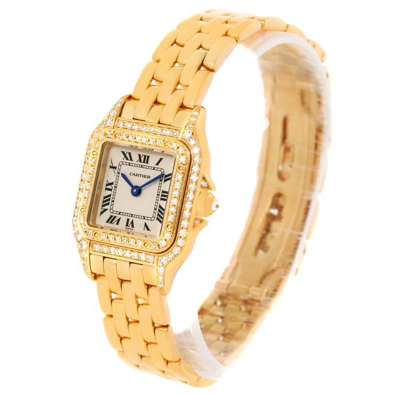 The Cartier Panthere WF3072B9 Women's Yellow Gold Silver Dial WF3072B9 Women's Yellow Gold Silver Dial watch is shown at an angle highlighting the gold bracelet, diamond-studded bezel, and Roman numeral dial.