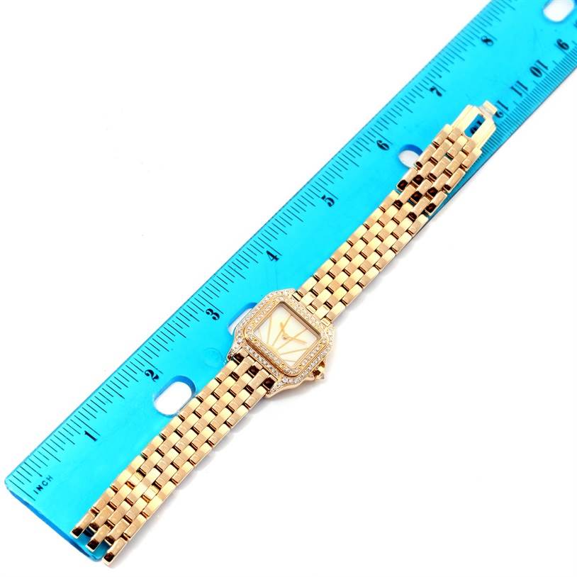 The image shows the entire Panthere de Cartier watch laid flat next to a ruler for scale.