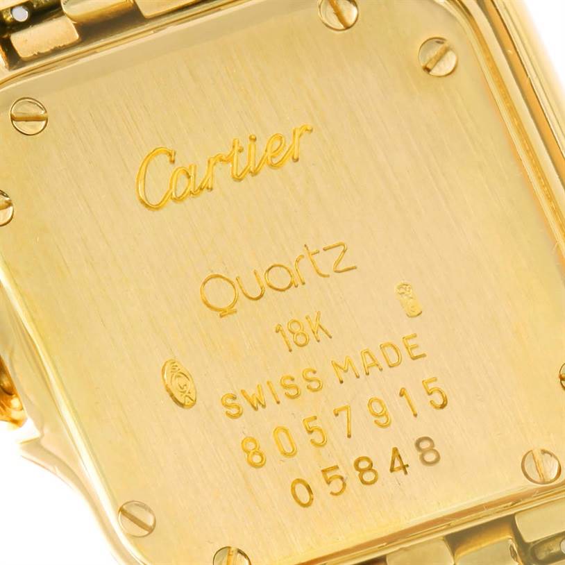 This is a close-up shot of the back case of a Cartier Panthère watch showing the engraved details and screws.