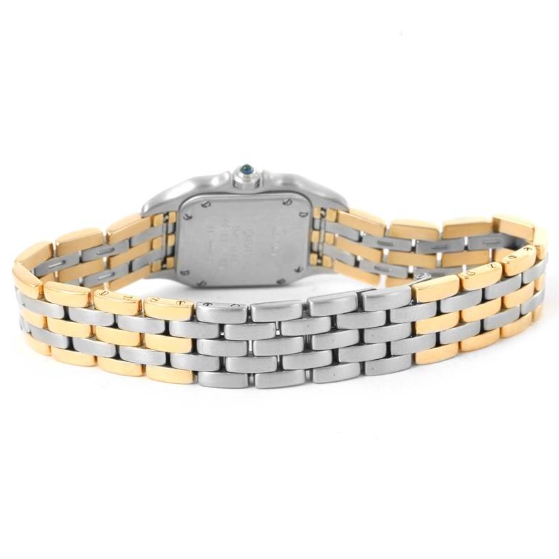 The image shows the back view of a Cartier Panthère watch, highlighting its two-tone bracelet and case back.