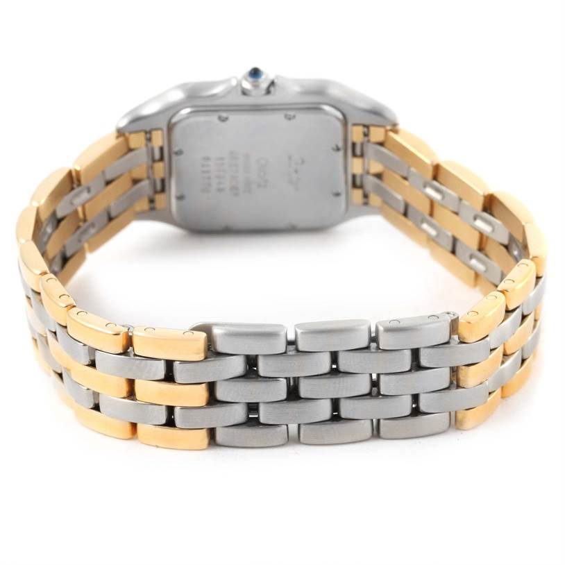 The image shows the back view of a Panthere model by Cartier, highlighting the case back and the two-tone metal bracelet.