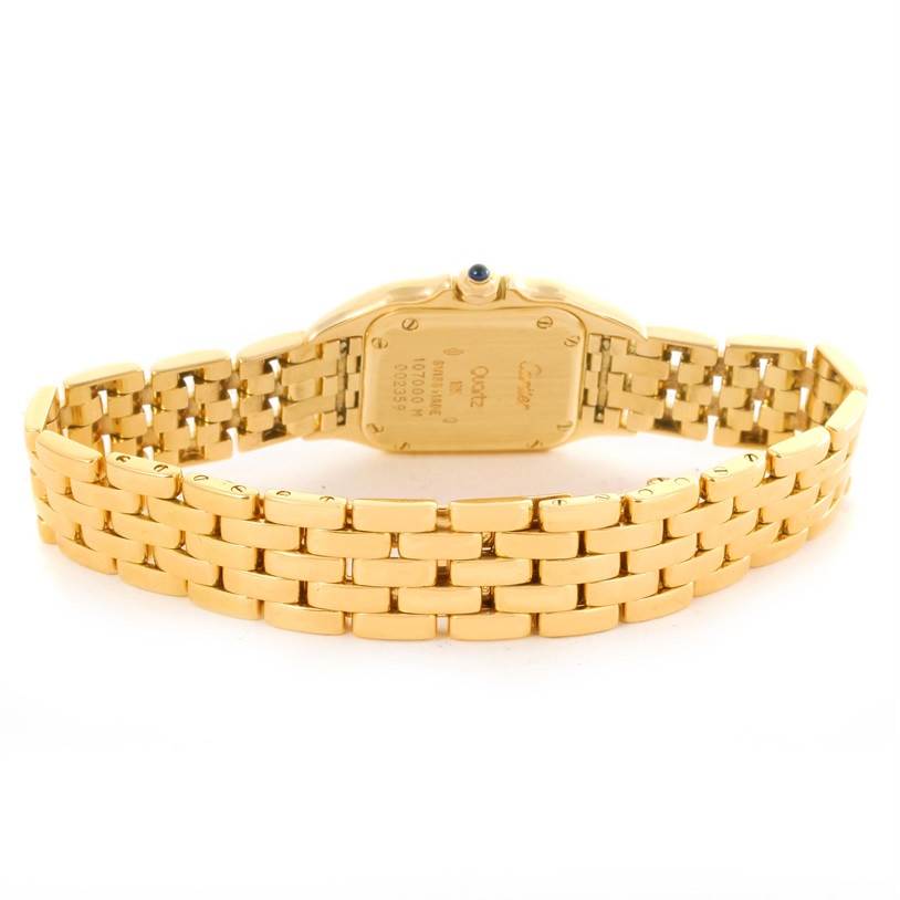 The image shows the back view of a Cartier Panthere W25022B9 Women's Yellow Gold Silver Dial W25022B9 Women's Yellow Gold Silver Dial model watch, focusing on its gold bracelet and case back.