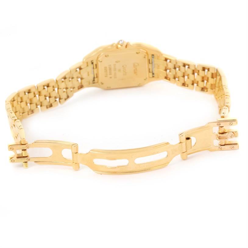 The image shows the back and clasp of a Cartier Panthere W25022B9 Women's Yellow Gold Silver Dial W25022B9 Women's Yellow Gold Silver Dial watch, focusing on the bracelet and case back.