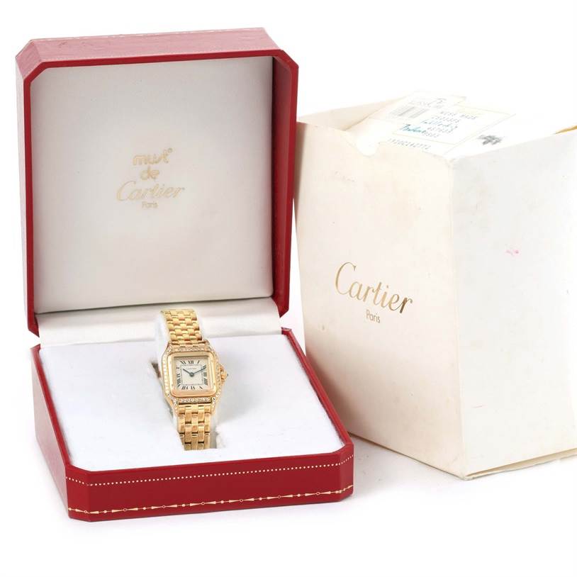 The Cartier Panthere W25022B9 Women's Yellow Gold Silver Dial W25022B9 Women's Yellow Gold Silver Dial watch is shown from a front angle, placed in its open box with the outer box beside it.
