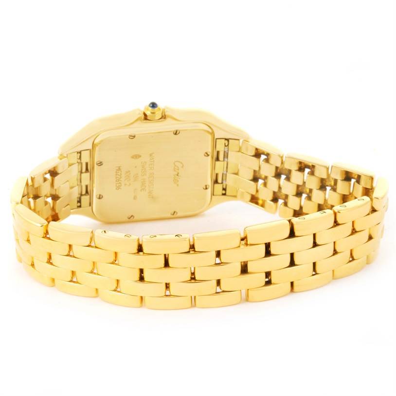 The image shows the back of a Panthere model by Cartier, highlighting the case back and gold bracelet.