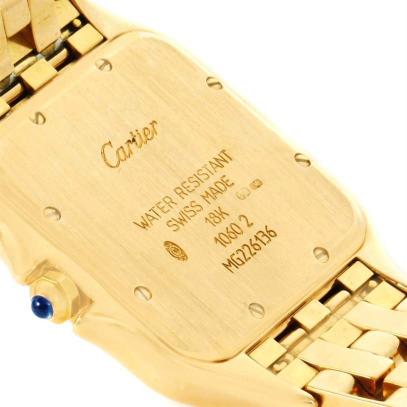 The image shows the back case of a Cartier Panthere W25014B9 Yellow Gold Silver Dial W25014B9 Yellow Gold Silver Dial watch, displaying engraving details and part of the gold bracelet.