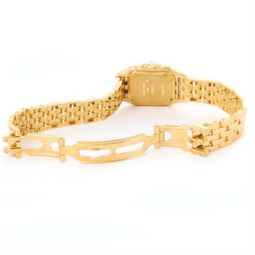 The image shows the backside and clasp of a Cartier Panthere W25022B9 Women's Yellow Gold Mother of Pearl Dial W25022B9 Women's Yellow Gold Mother of Pearl Dial watch, highlighting the gold bracelet and case.