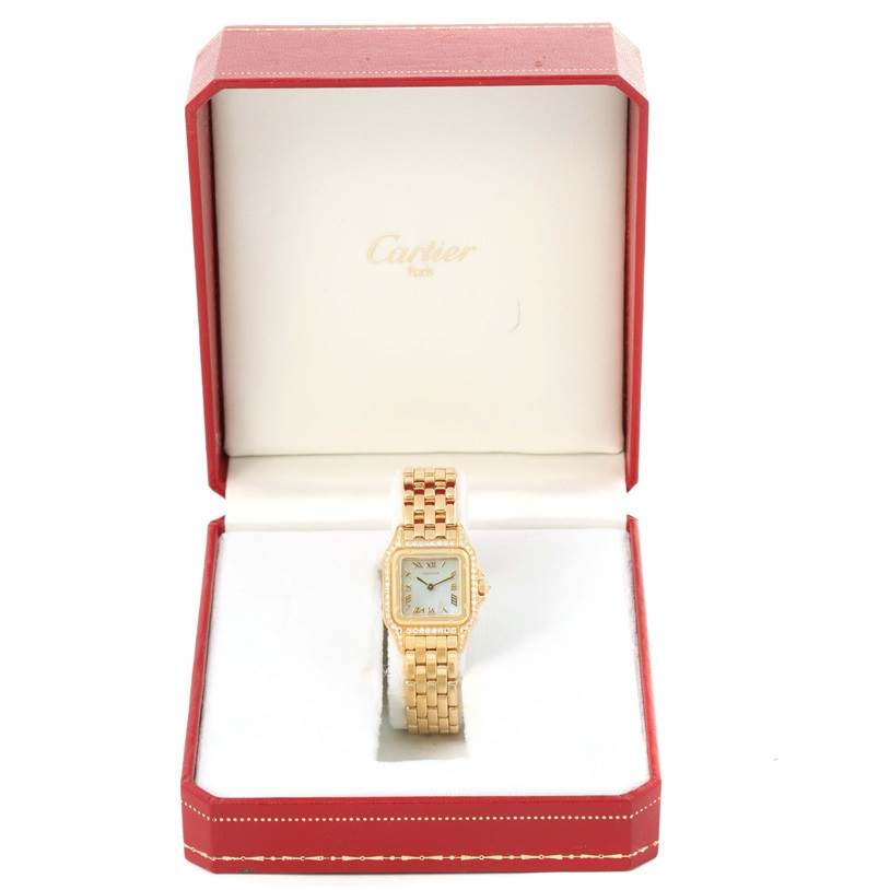 The Cartier Panthère watch is shown from the front, placed in an open red and white Cartier box.