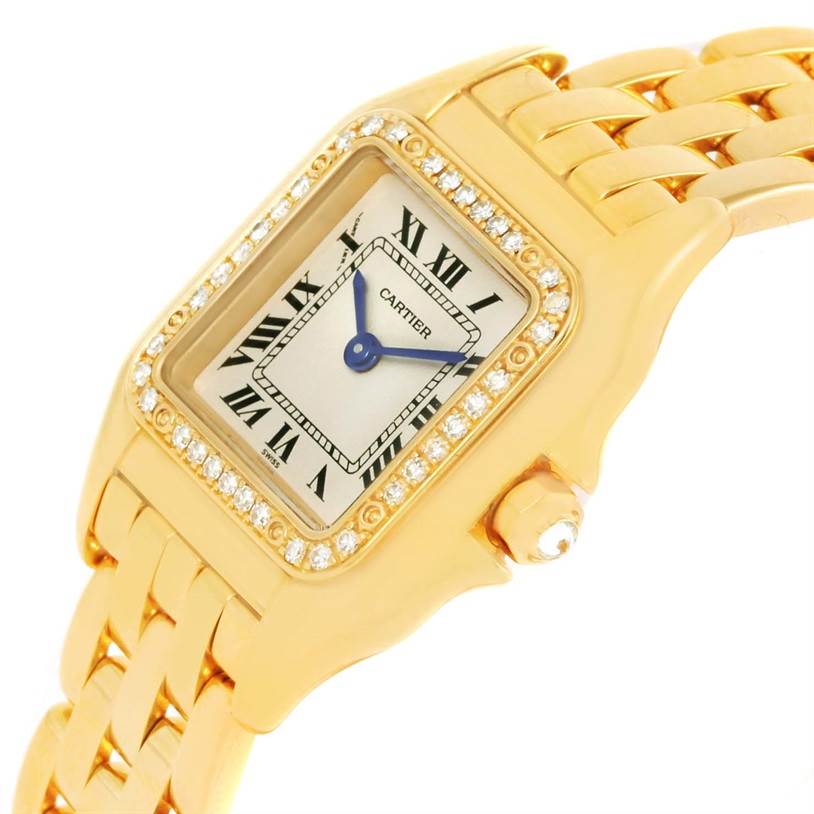 The image shows a close-up angle of the Cartier Panthere WF3070B9 Women's Yellow Gold Silver Dial WF3070B9 Women's Yellow Gold Silver Dial watch, highlighting its face, bezel, and part of the gold bracelet.