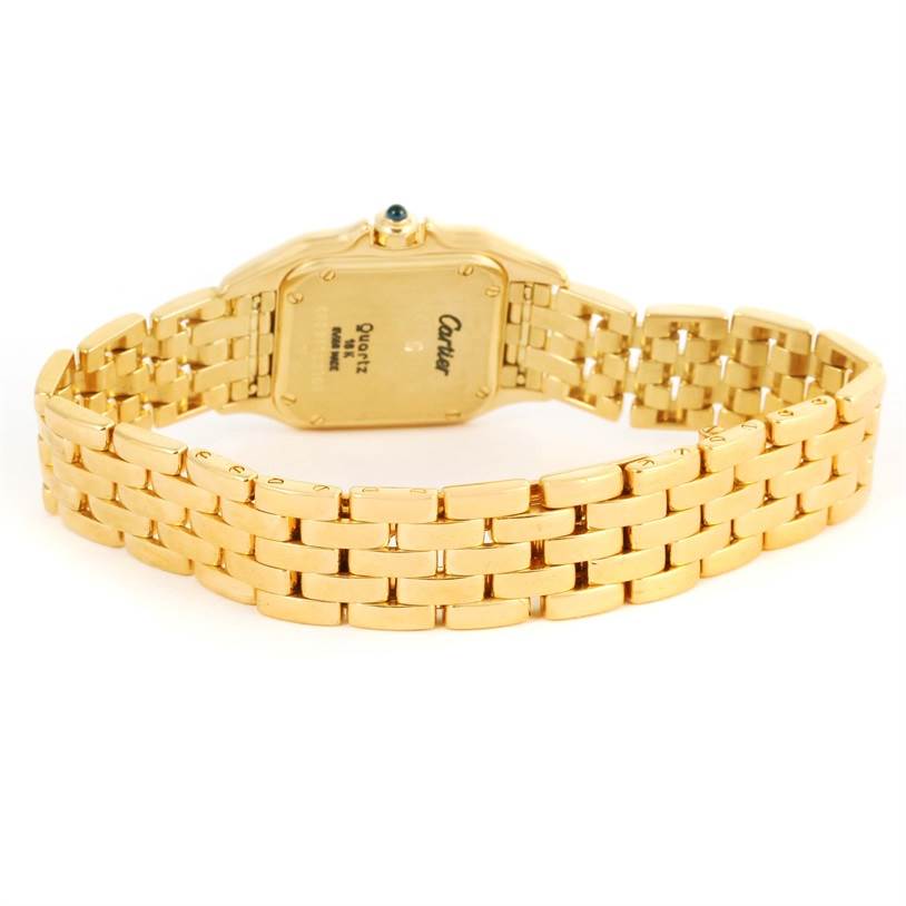 The image shows the Panthere model by Cartier from a rear angle, focusing on the gold bracelet and watch back.