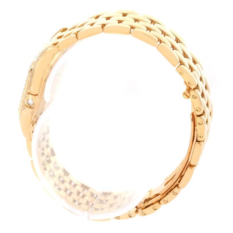 The image shows a side view of the gold bracelet and clasp of the Panthere model by Cartier.