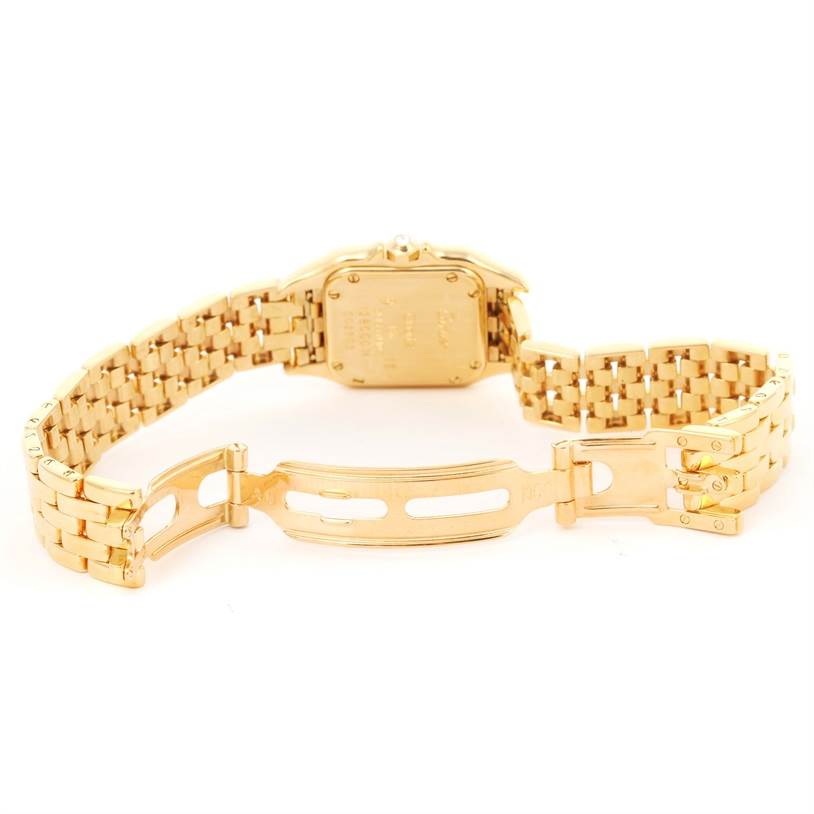 The image shows the back view of the Cartier Panthere WF3072B9 Women's Yellow Gold Silver Dial WF3072B9 Women's Yellow Gold Silver Dial watch, focusing on the open clasp and gold bracelet.