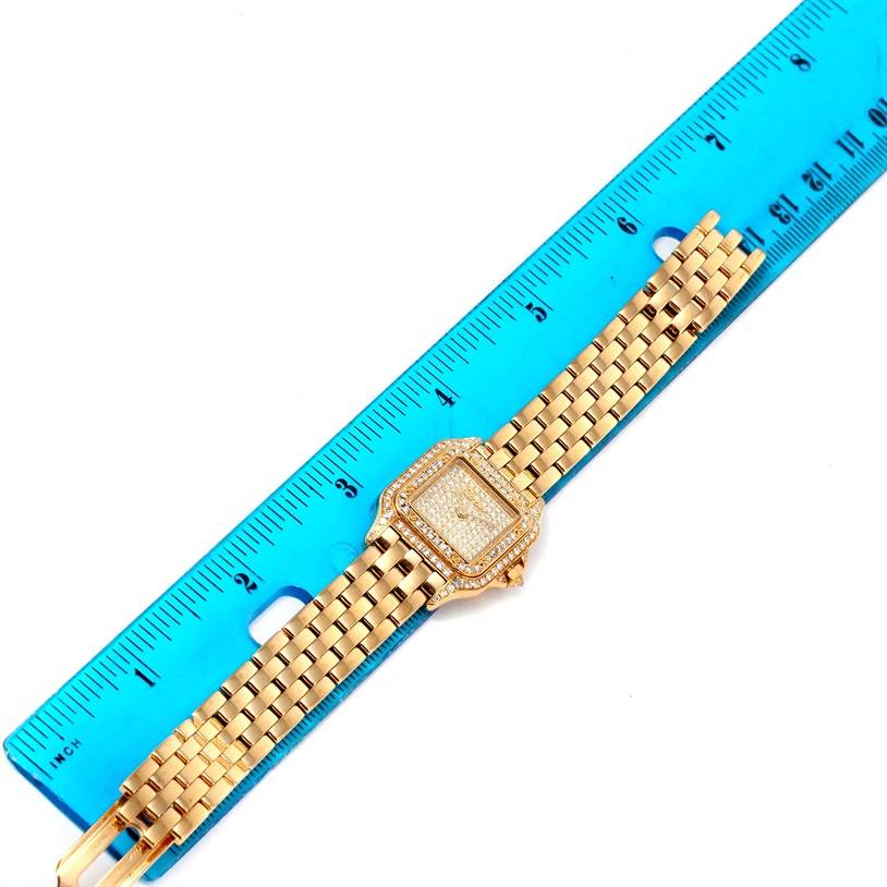 The image shows a top-down view of a Cartier Panthere 128000 Women's Yellow Gold Champagne Dial 128000 Women's Yellow Gold Champagne Dial watch, highlighting its gold bracelet and diamond-studded square dial.