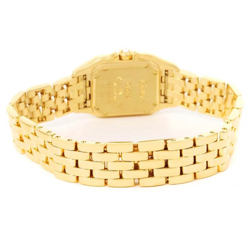 This image shows the underside and the bracelet of a Cartier Panthere 128000 Women's Yellow Gold Champagne Dial 128000 Women's Yellow Gold Champagne Dial watch from a rear angle.