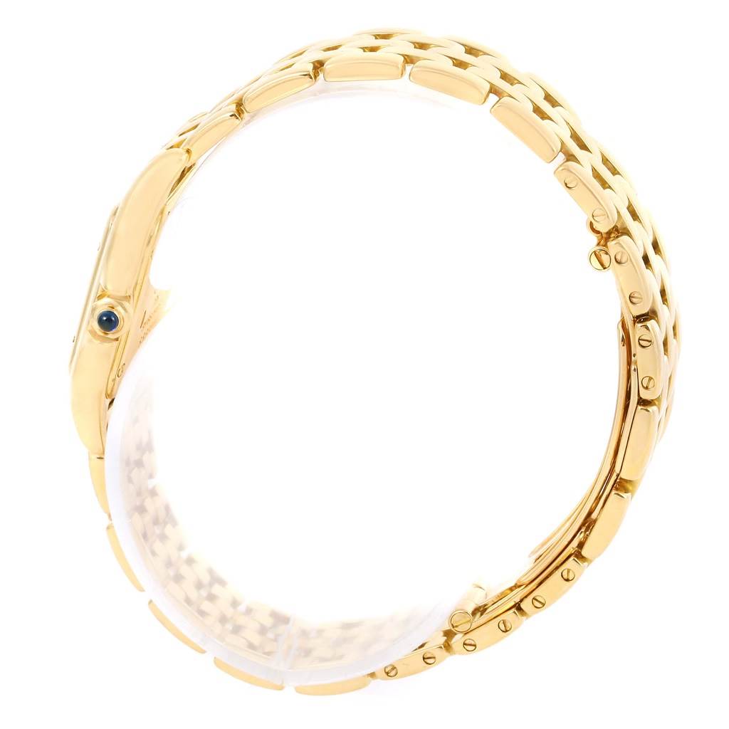 The image shows a side view of the bracelet and casing of a Cartier Panthere W25022B9 Women's Yellow Gold Silver Dial W25022B9 Women's Yellow Gold Silver Dial watch, showcasing its gold links and sapphire crown.