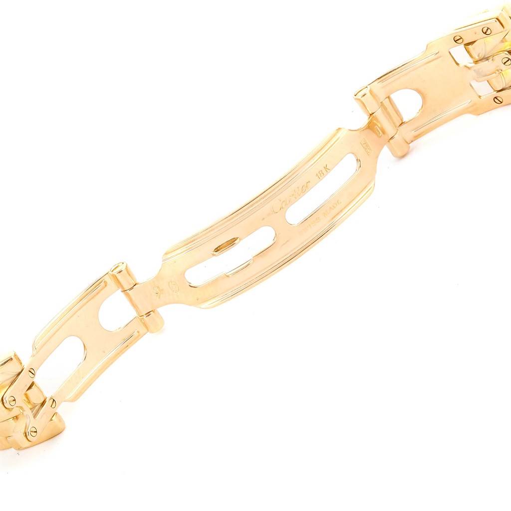 The image shows the gold clasp of the Cartier Panthere W25022B9 Women's Yellow Gold Silver Dial W25022B9 Women's Yellow Gold Silver Dial watch, viewed from a top-down angle.