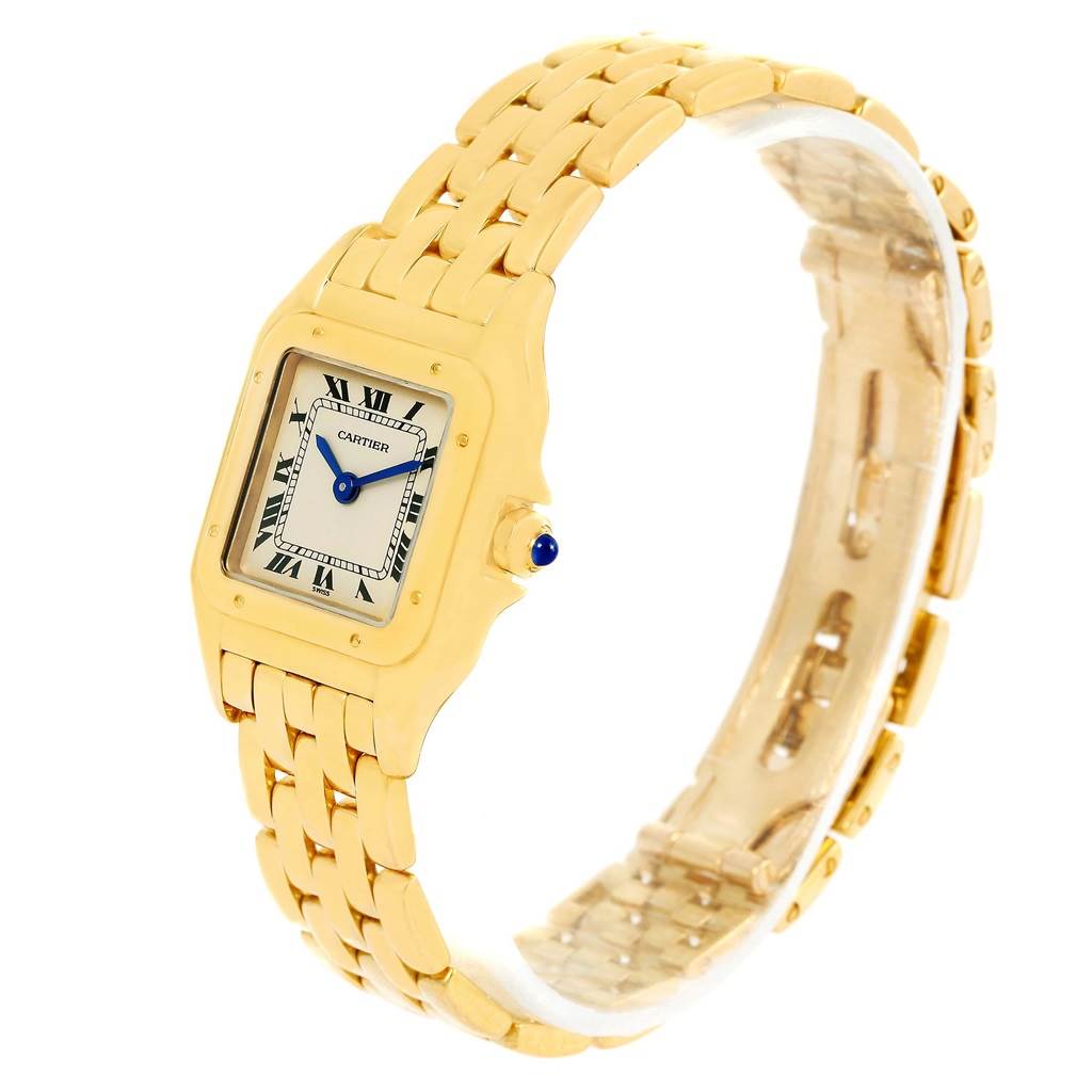 This Cartier Panthère watch is shown at an angle highlighting its gold bracelet, square case, and Roman numeral dial.