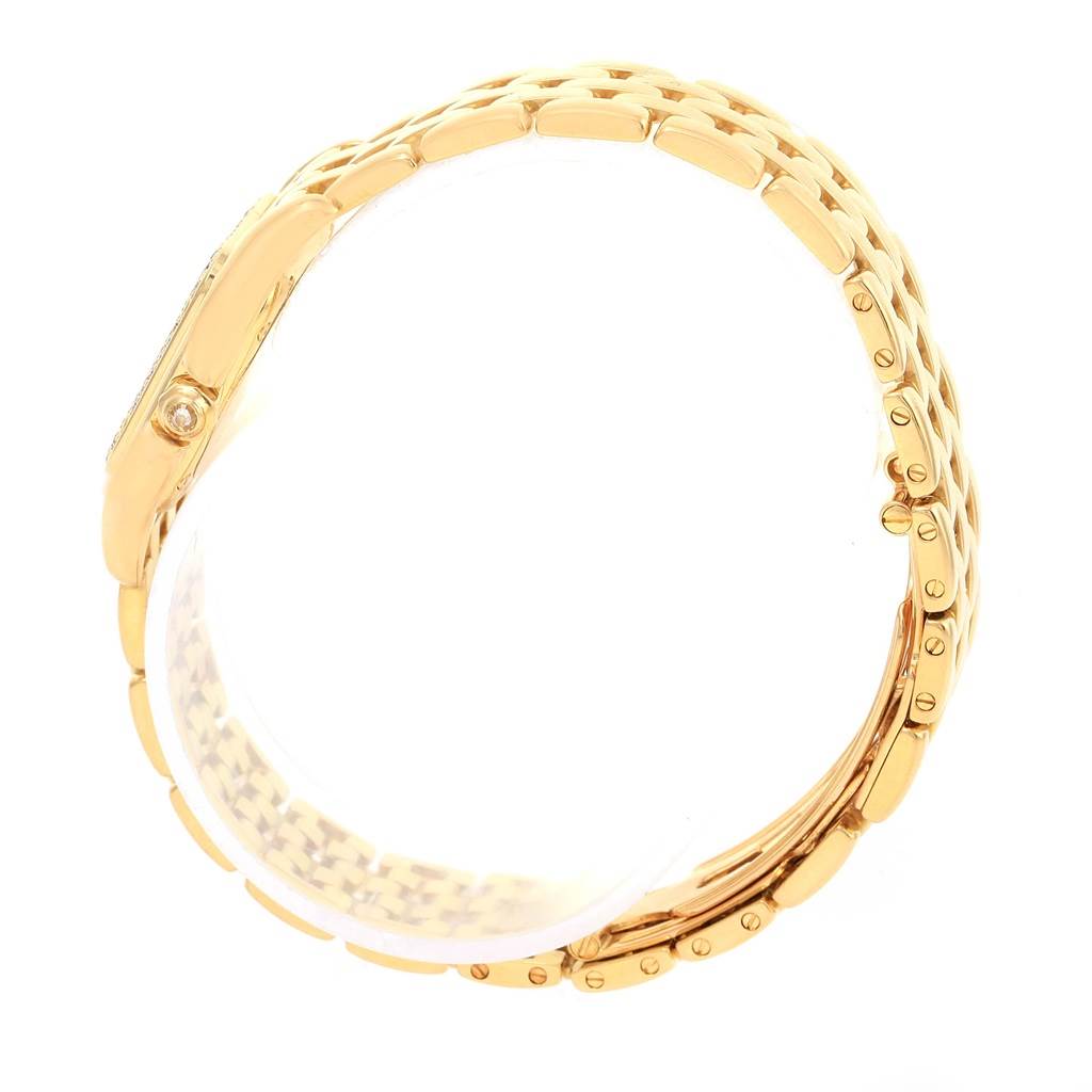 The Cartier Panthère model watch is shown from a side angle, focusing on its gold bracelet and case side.