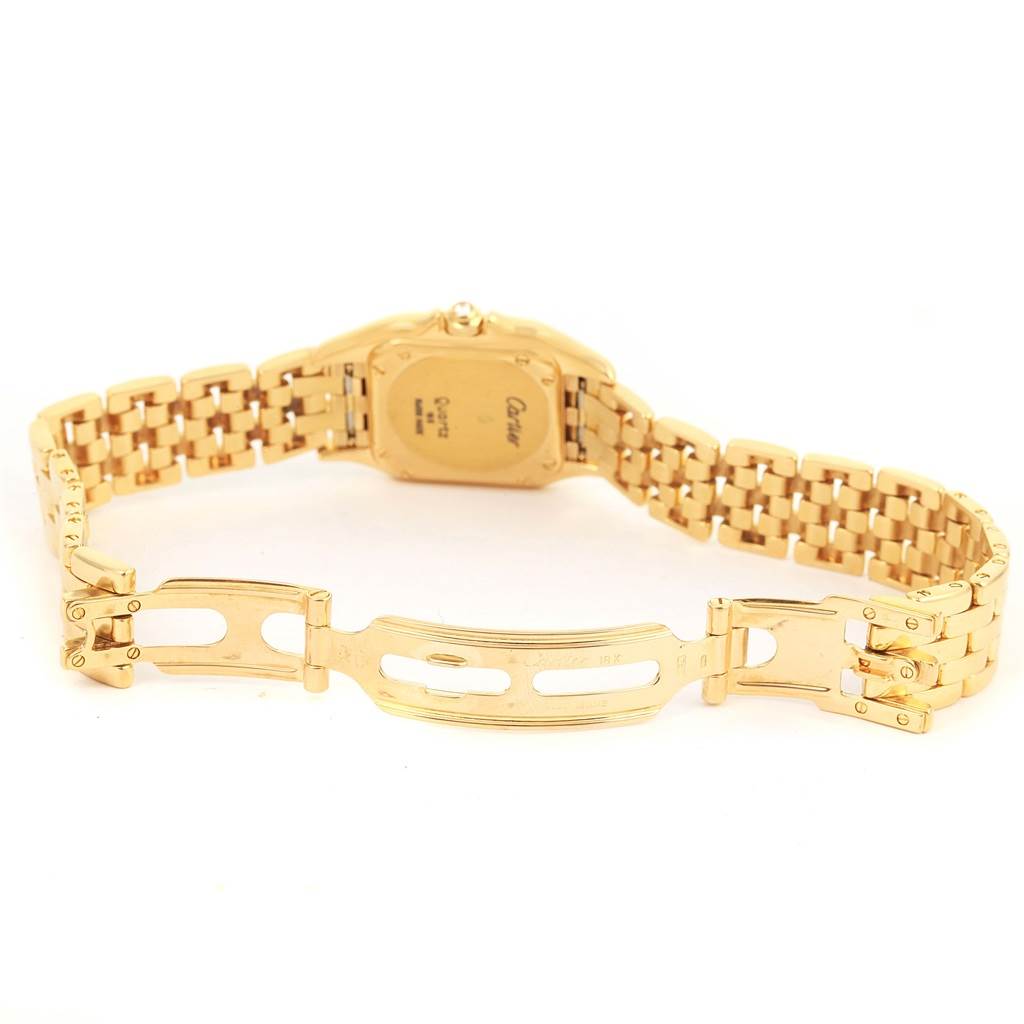 The image shows the back view of the Cartier Panthere WF3070B9 Women's Yellow Gold Silver Dial WF3070B9 Women's Yellow Gold Silver Dial watch, including its gold case back and partially open bracelet clasp.