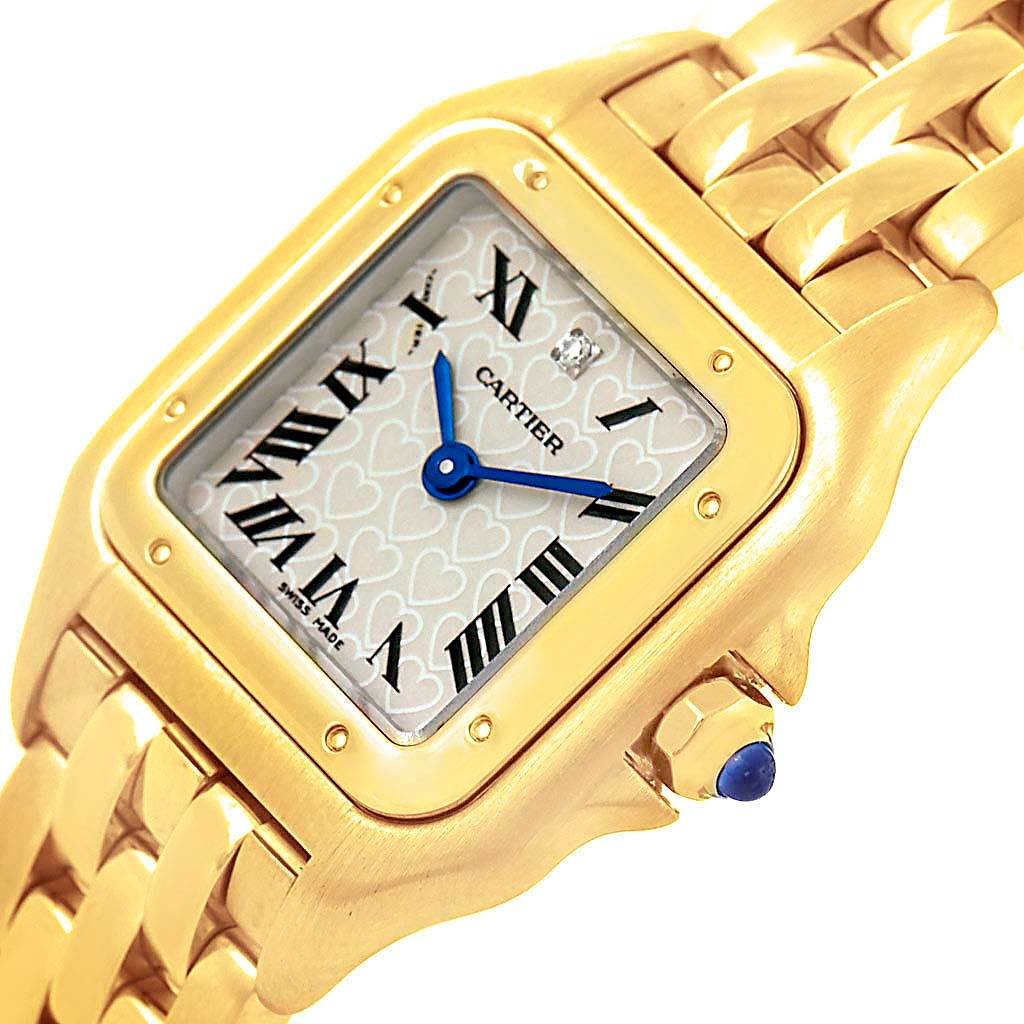 The image shows a Cartier Panthère model watch from an oblique angle, focusing on the face, bezel, and part of the bracelet.