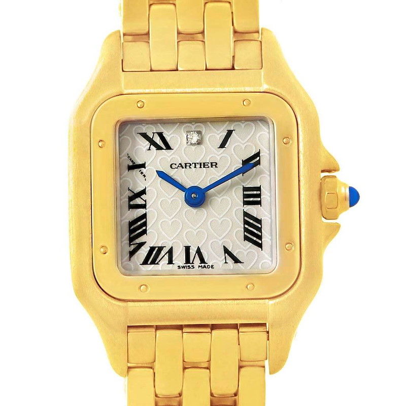 The Cartier Panthere watch is shown from a frontal angle, displaying its gold case, bracelet, and heart-patterned dial.