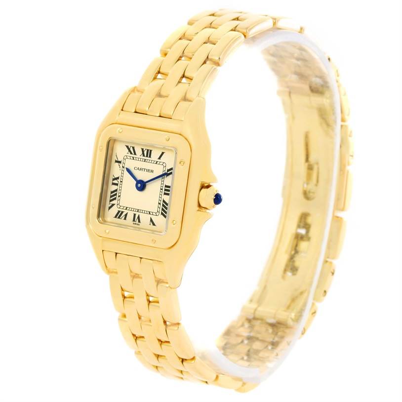This image shows a Cartier Panthere W25022B9 Women's Yellow Gold Silver Dial W25022B9 Women's Yellow Gold Silver Dial watch at an angled view, displaying its gold bracelet, square face, and crown with a blue cabochon.
