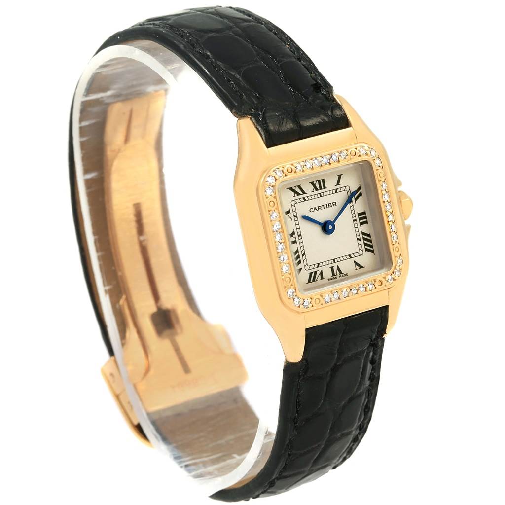The image shows a Cartier Panthere WF3070B9 Women's Yellow Gold Silver Dial WF3070B9 Women's Yellow Gold Silver Dial watch featuring a square face with Roman numerals, a diamond bezel, and a black leather strap.