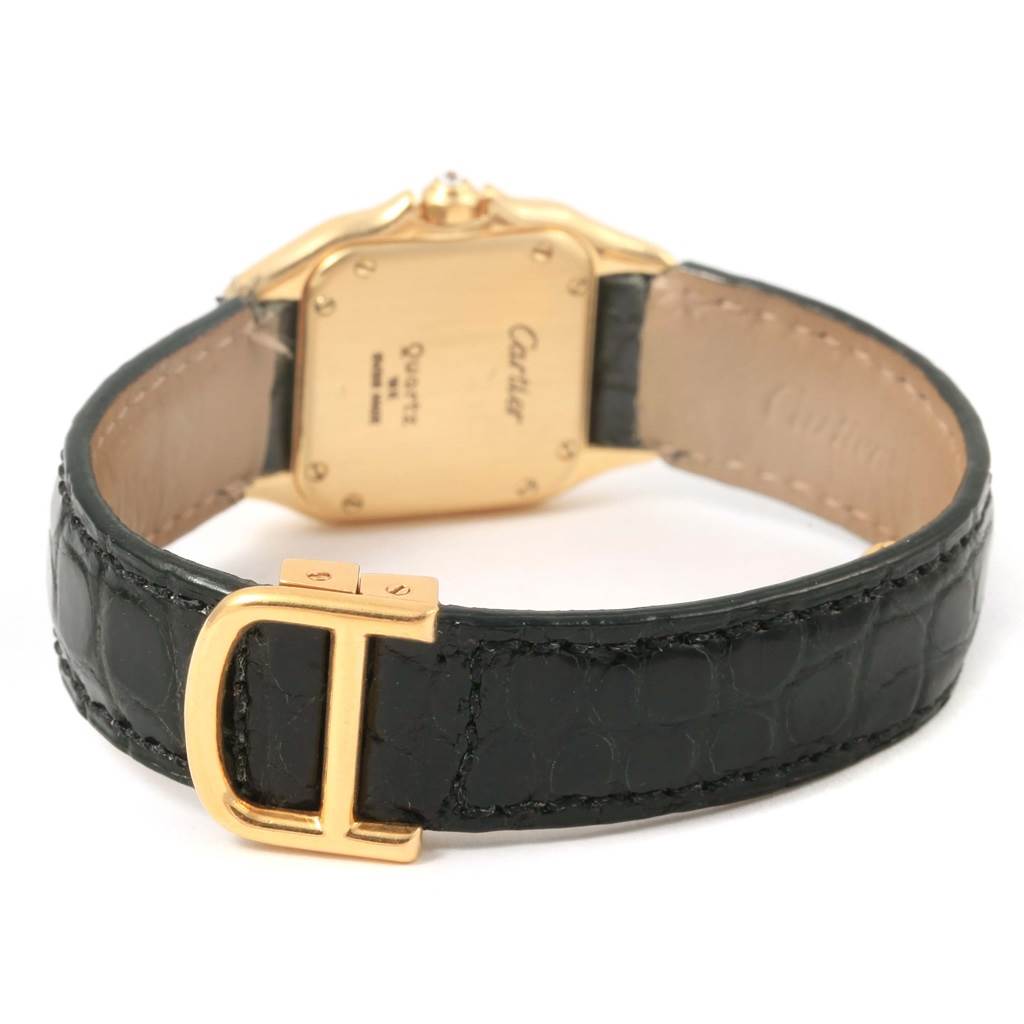 The image shows the back of a Cartier Panthere WF3070B9 Women's Yellow Gold Silver Dial WF3070B9 Women's Yellow Gold Silver Dial watch, focusing on the case back and the leather strap with a gold buckle.