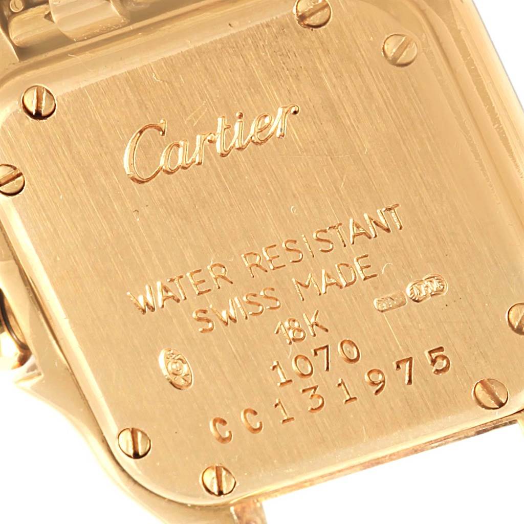 The image shows the back case of a Panthere model watch by Cartier, featuring engraved details and screws.